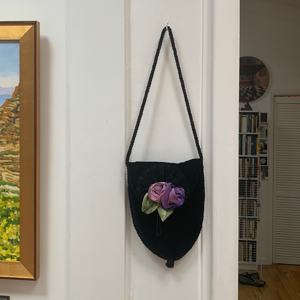 Small black velvet bag with a short handle